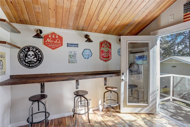 interior space featuring wooden ceiling, vaulted ceiling, and wood finished floors