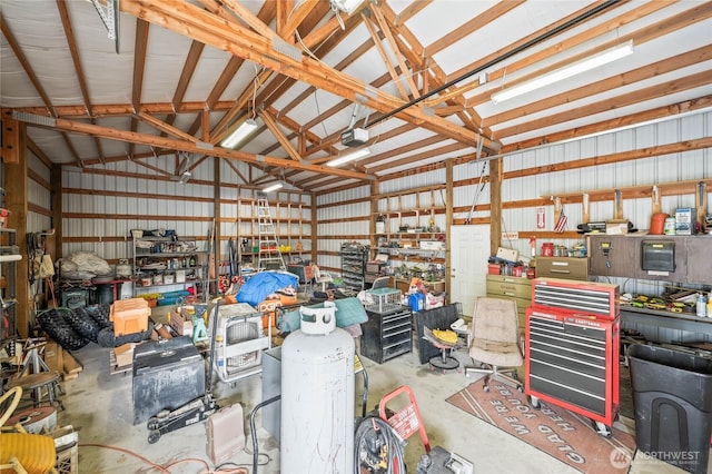 garage with metal wall and a workshop area