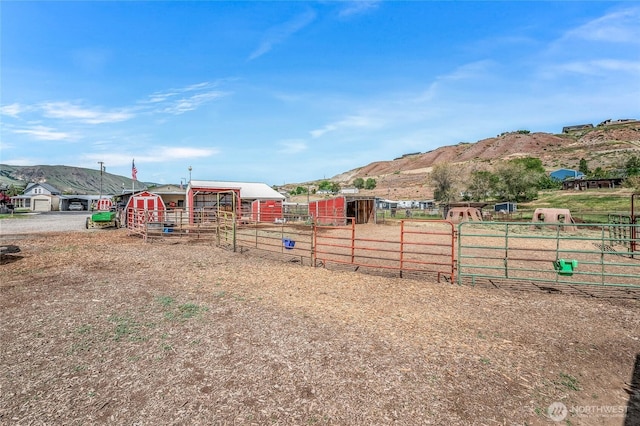 2701 Rock Island Rd, East Wenatchee, WA 98802 - view of yard featuring an outbuilding, a mountain view, an exterior structure, and fence