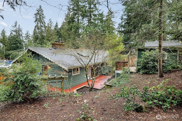 rear view of house with a chimney