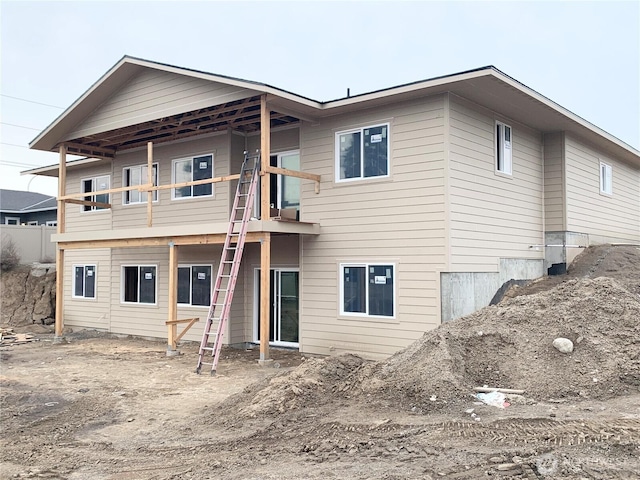 back of house with a balcony