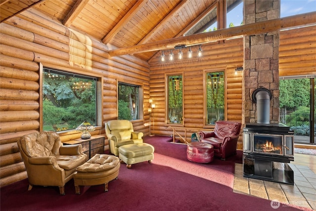 interior space with wood ceiling, a wood stove, and vaulted ceiling with beams