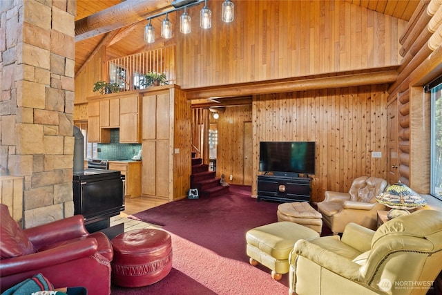 carpeted living room featuring high vaulted ceiling, beam ceiling, wooden ceiling, and a wood stove