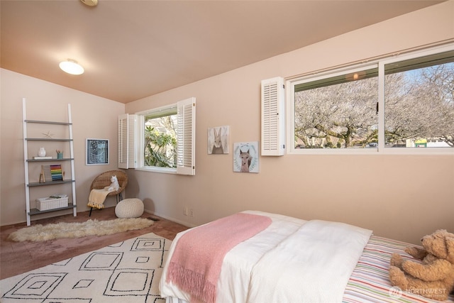 bedroom with carpet flooring and baseboards