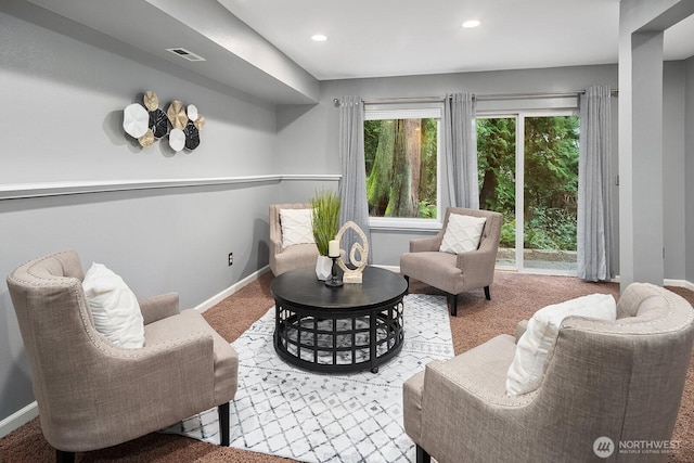 sitting room featuring carpet, visible vents, baseboards, and recessed lighting