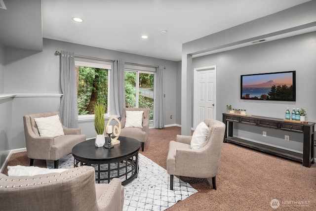 living area featuring recessed lighting, light carpet, visible vents, and baseboards