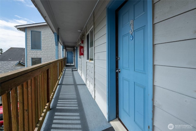 view of exterior entry featuring covered porch