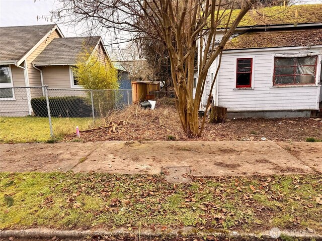 view of property exterior featuring fence