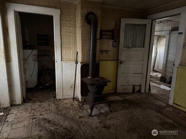 hallway featuring water heater