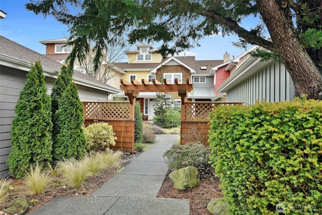 view of front of property with a pergola