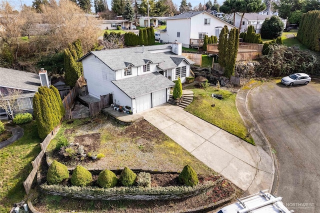 birds eye view of property with a residential view