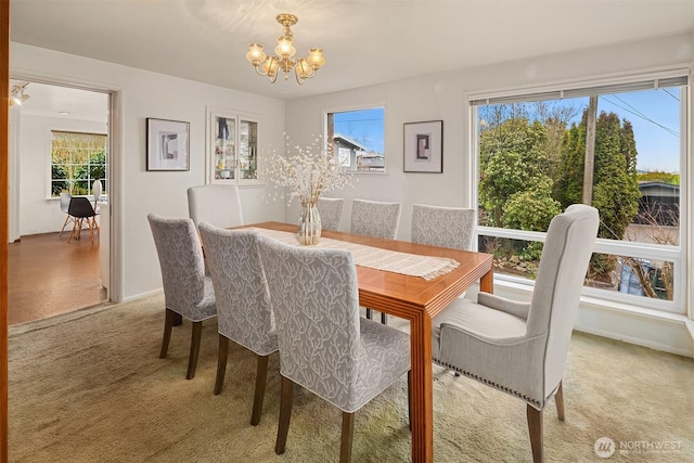 dining area with a notable chandelier