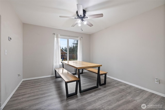 dining area featuring ceiling fan, wood finished floors, and baseboards