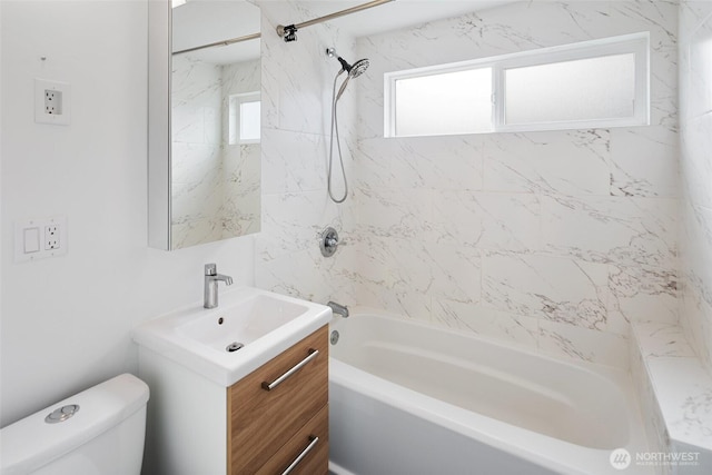 bathroom featuring shower / bath combination, vanity, and toilet