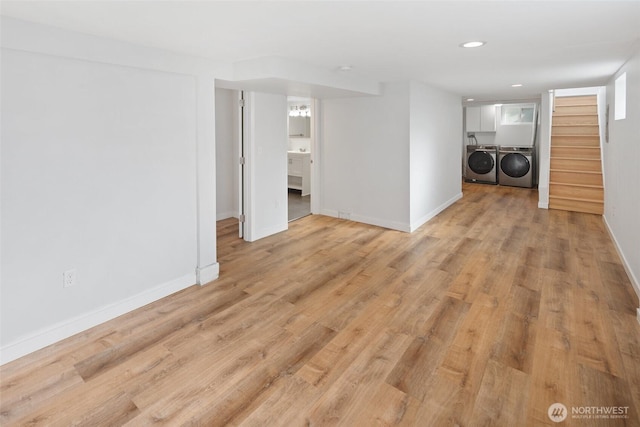 interior space featuring washer and clothes dryer, recessed lighting, light wood-style flooring, baseboards, and stairs