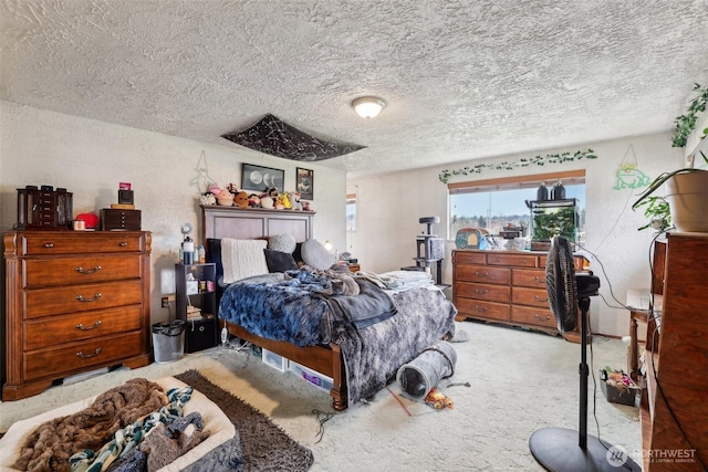 bedroom featuring carpet flooring, a textured wall, and a textured ceiling