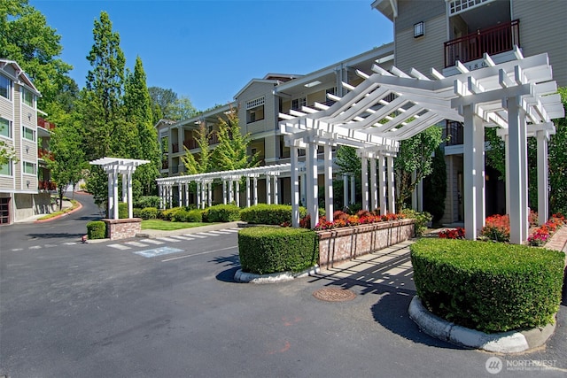 surrounding community with a pergola