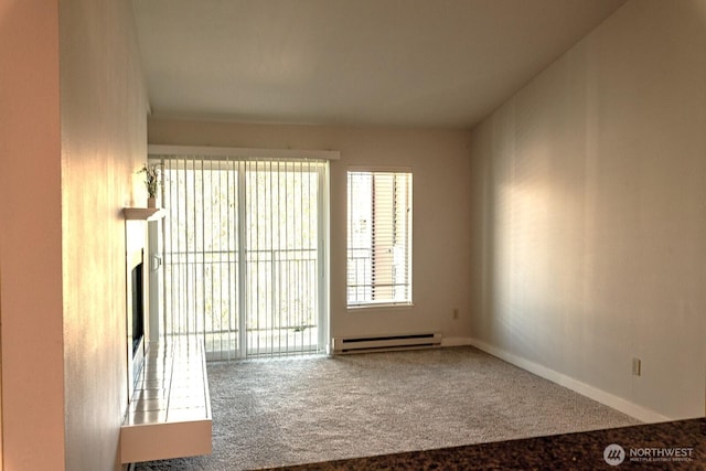 unfurnished room with a fireplace, baseboards, carpet floors, and a baseboard radiator