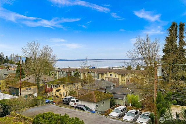 exterior space with a water view and a residential view