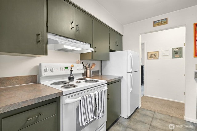 kitchen featuring white appliances, light colored carpet, under cabinet range hood, green cabinets, and light tile patterned flooring