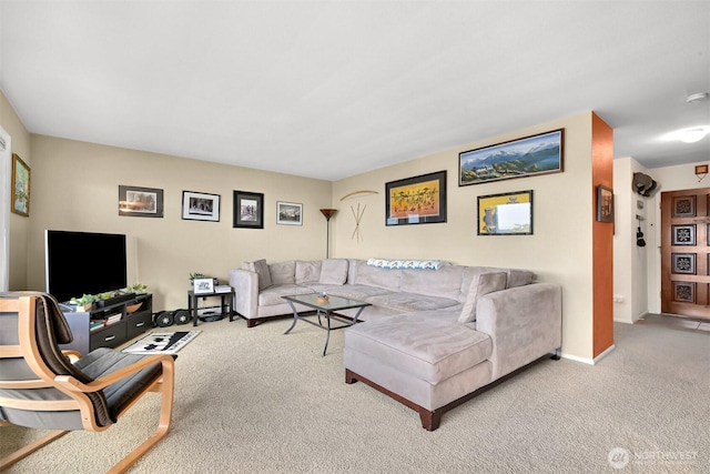 living room with light carpet and baseboards