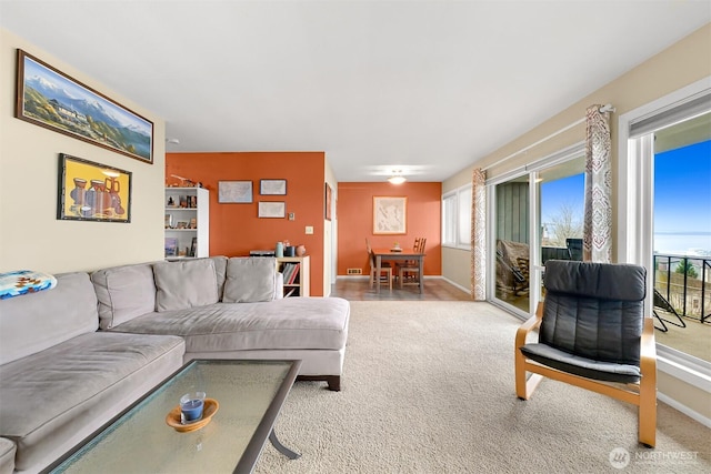 living area with carpet and baseboards