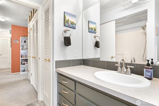 bathroom featuring a closet and vanity