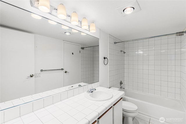 bathroom featuring shower / tub combination, vanity, and toilet