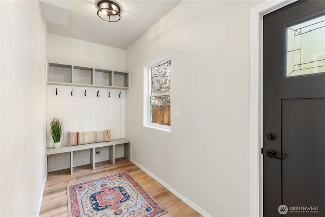 mudroom with light wood-type flooring and baseboards