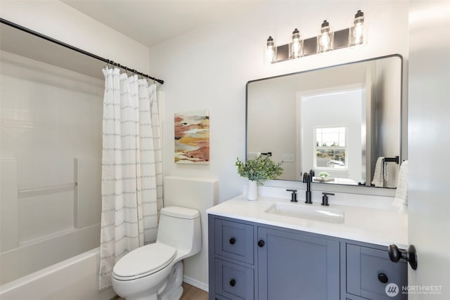 full bath featuring shower / bath combo, vanity, and toilet