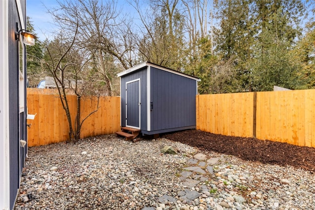 view of shed featuring a fenced backyard