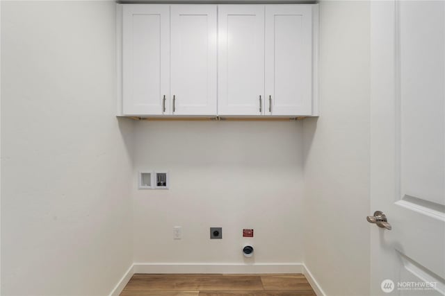 clothes washing area with washer hookup, baseboards, cabinet space, light wood finished floors, and electric dryer hookup