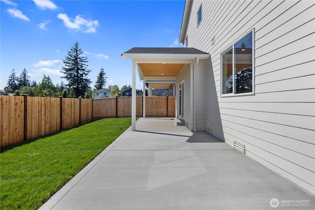 view of patio featuring a fenced backyard and visible vents