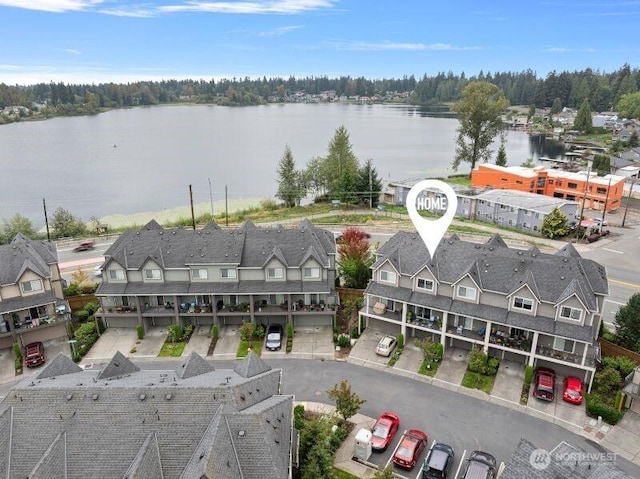 bird's eye view with a residential view and a water view