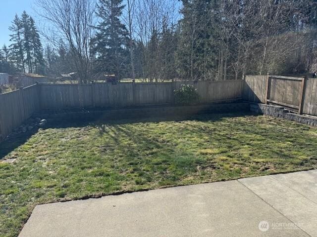 view of yard with a fenced backyard