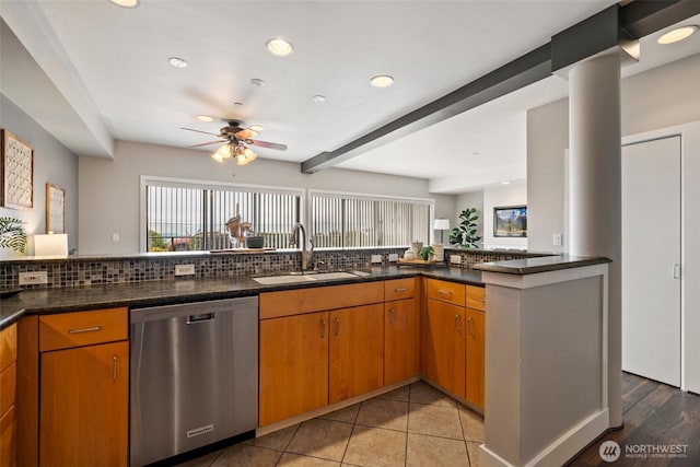 kitchen with a sink, tasteful backsplash, stainless steel dishwasher, and recessed lighting