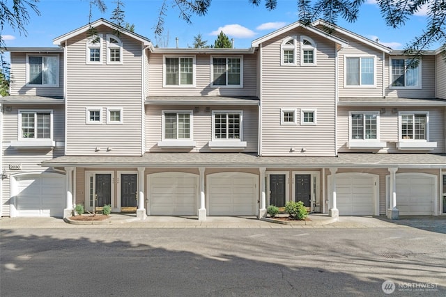 multi unit property featuring an attached garage