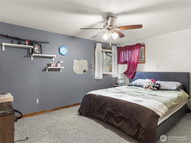 carpeted bedroom featuring ceiling fan and baseboards