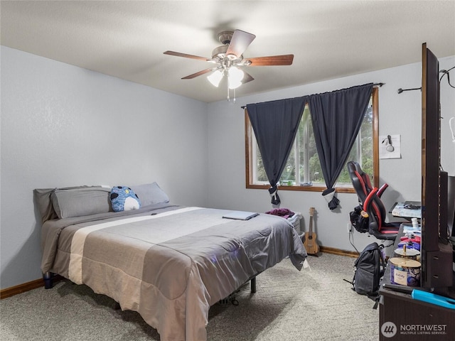 bedroom with carpet floors, ceiling fan, and baseboards