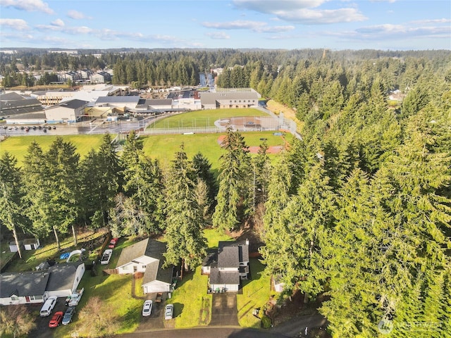 birds eye view of property with a residential view and a view of trees