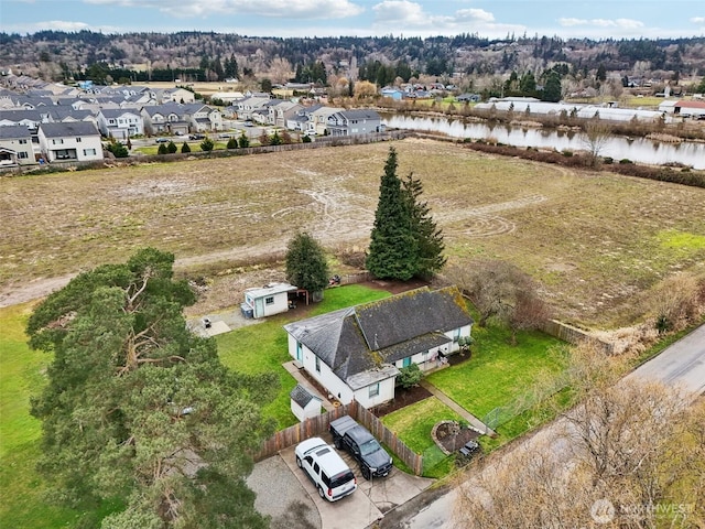 bird's eye view with a water view and a residential view