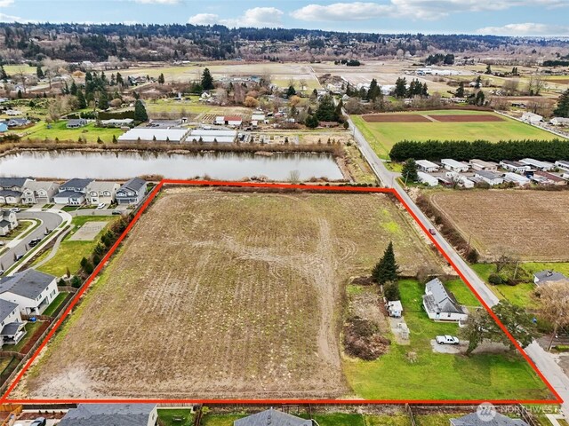 aerial view featuring a water view and a residential view