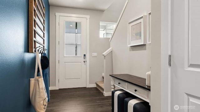 interior space featuring dark wood-style floors and baseboards