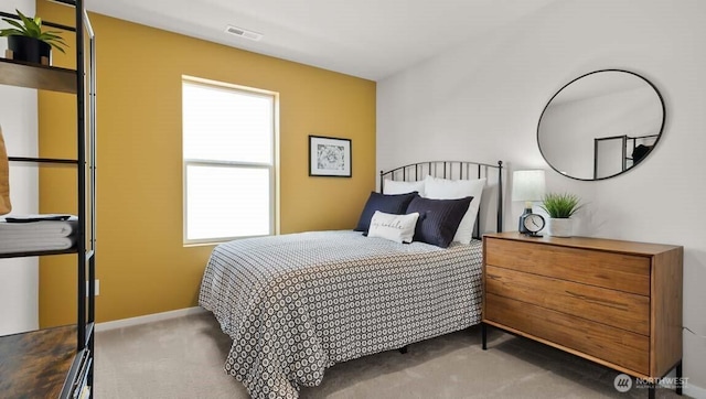 carpeted bedroom with visible vents