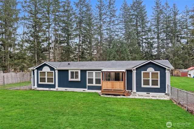 view of front of property with crawl space, fence, and a front yard