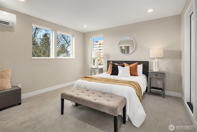 carpeted bedroom featuring recessed lighting, baseboards, and a wall mounted AC