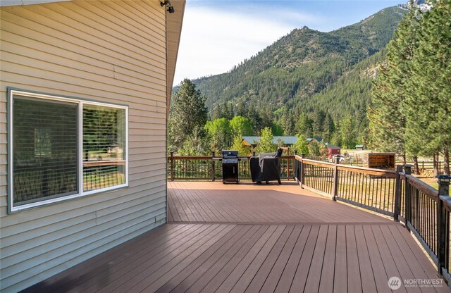 17353 Jenne Dr, Entiat, WA 98822 - wooden terrace with a mountain view and a grill