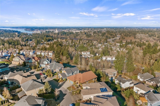 birds eye view of property with a residential view and a water view