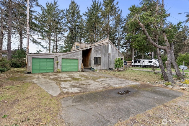 garage featuring driveway