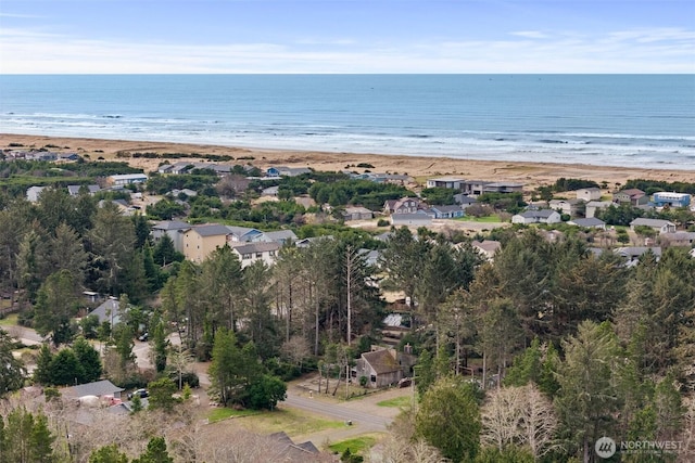 aerial view featuring a water view and a beach view